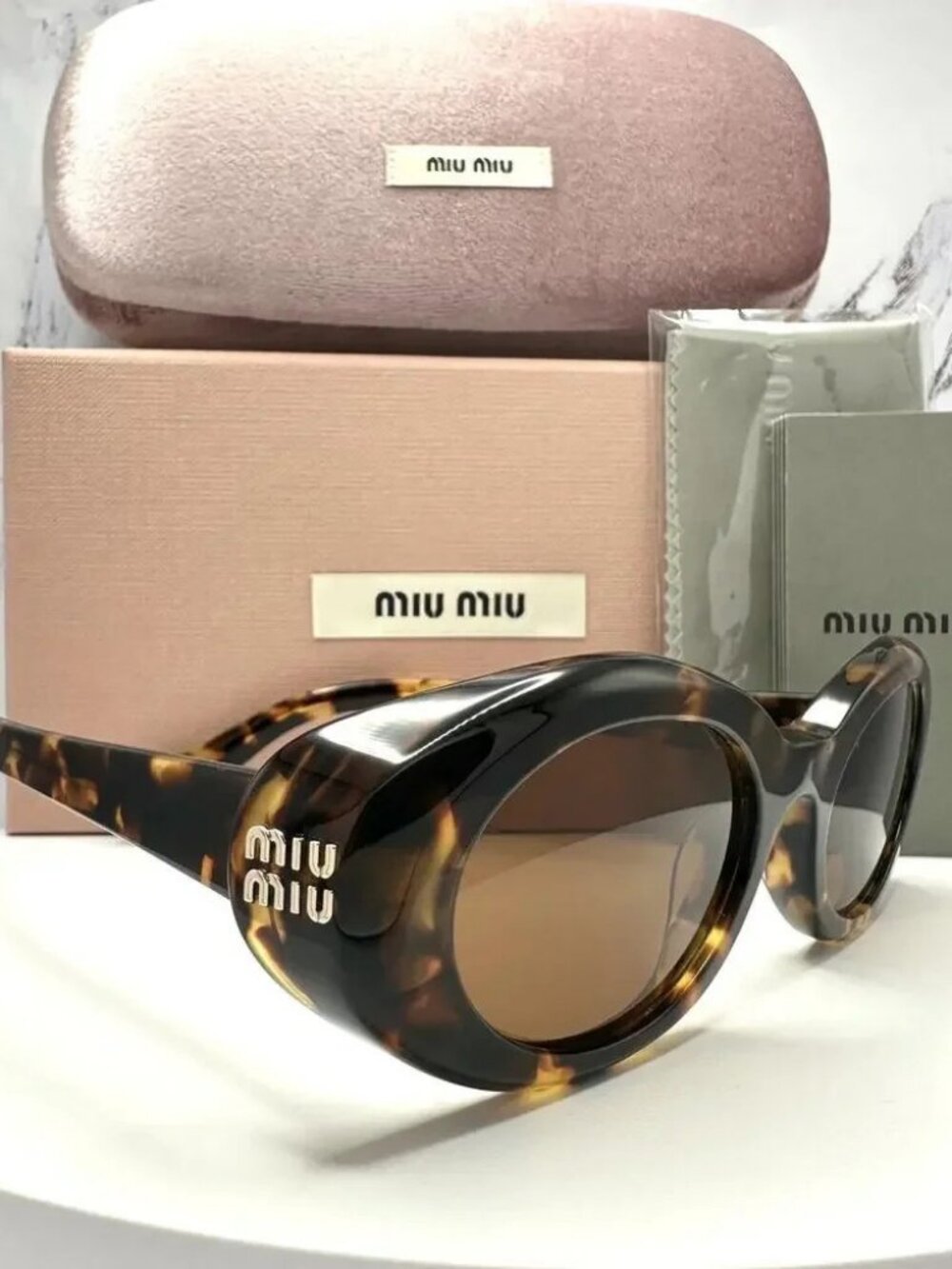 🕶️ Miu Miu Tortoiseshell Oval Sunglasses with Gold Logo ✨